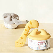 Yellow dinosaur-shaped tape dispenser with gray cat-themed design for Cococat silicone lid set