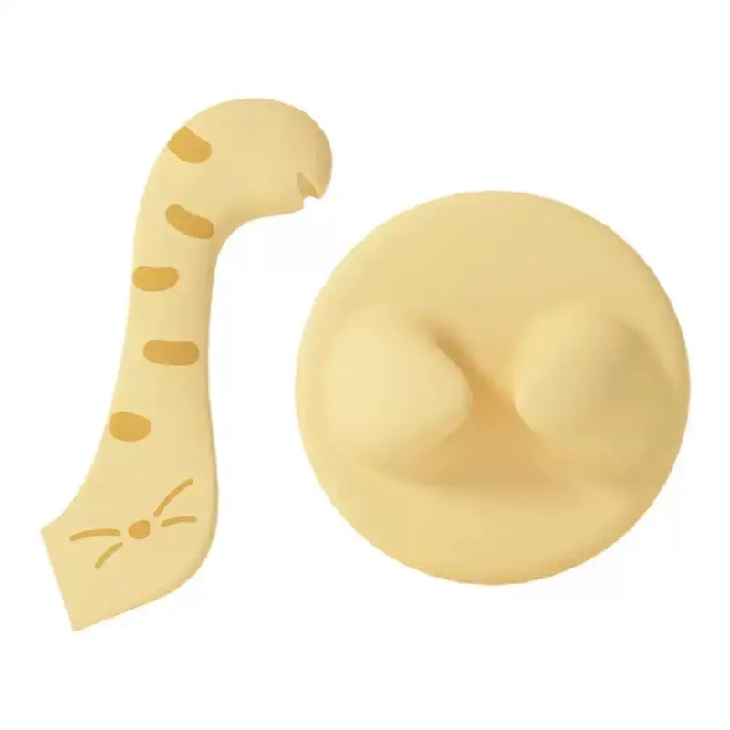 Yellow cat-shaped hook with tail and paw prints, part of Cococat silicone lid set