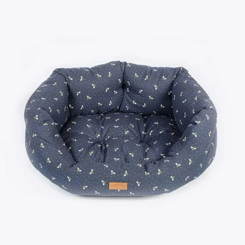Danish Design FatFace Spotty Bees Deluxe Slumber bed in navy blue with white bone pattern, cushioned interior and brown label
