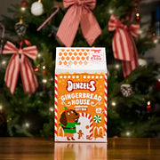 Gingerbread house gift box for dogs with festive decorations