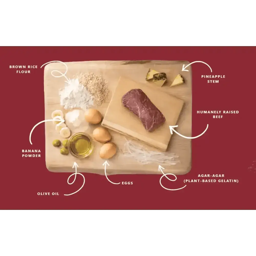 Wooden cutting board with ingredients for Earth Animal No-Hide Wholesome Beef Chew