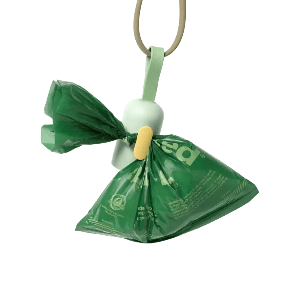 Earth Rated green plastic pet waste bag dispenser with white handle
