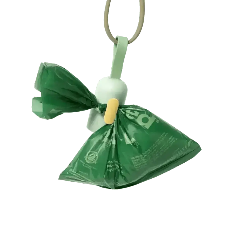 Earth Rated green plastic pet waste bag dispenser with white handle