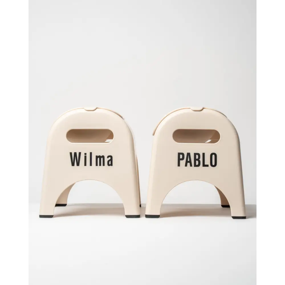 Cream-colored EasyEat slow feeder stools with Wilma and Pablo names
