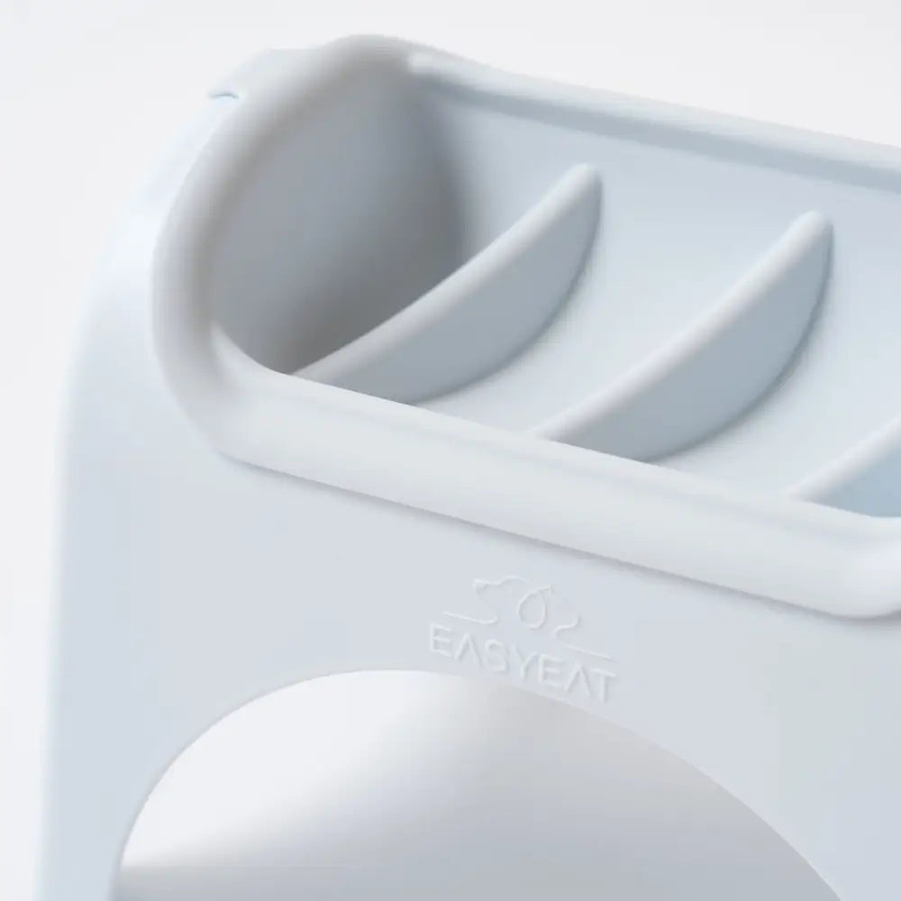 Light gray EasyEat slow feeder toothbrush holder with curved slots