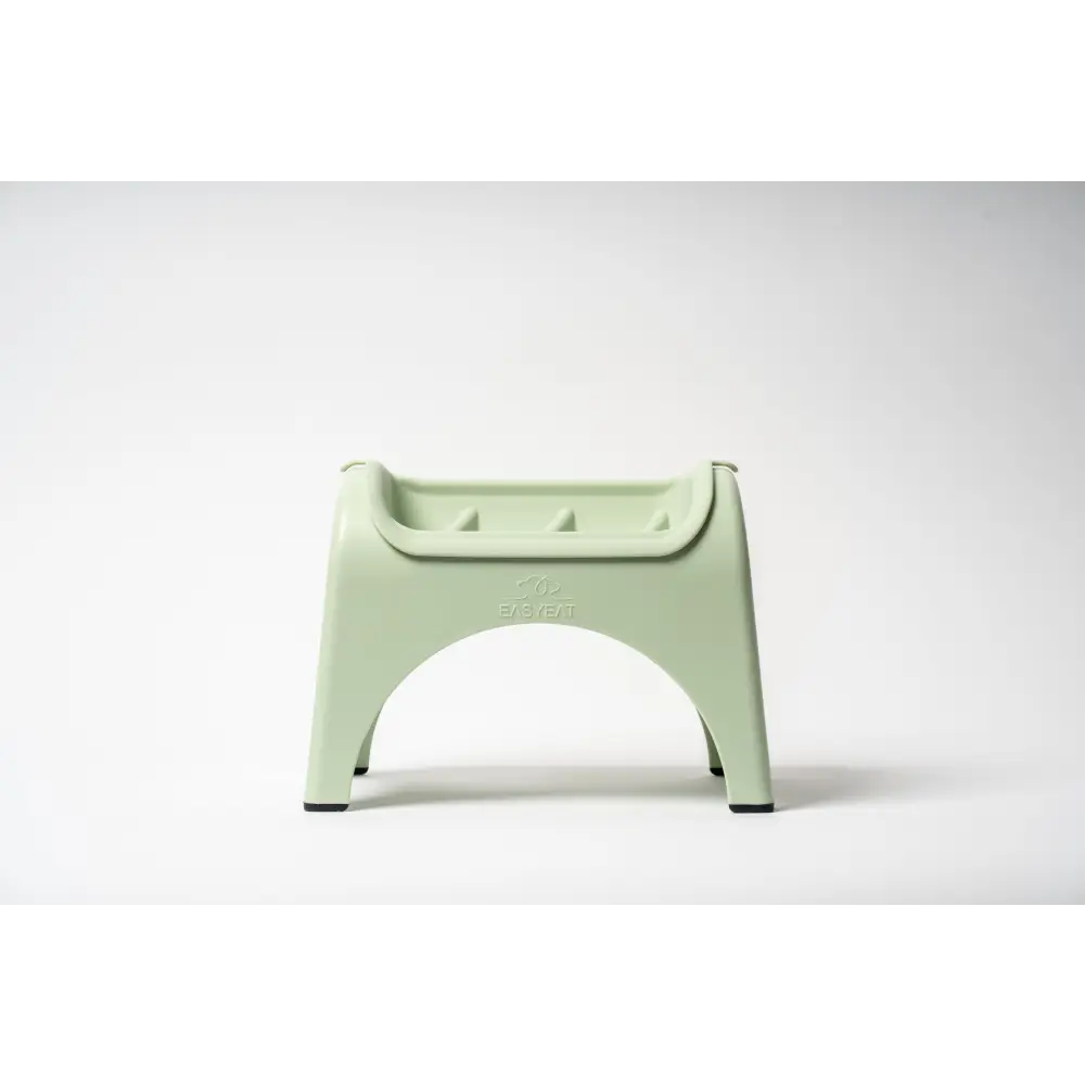 Light mint green EasyEat slow feeder plastic step stool with curved seat
