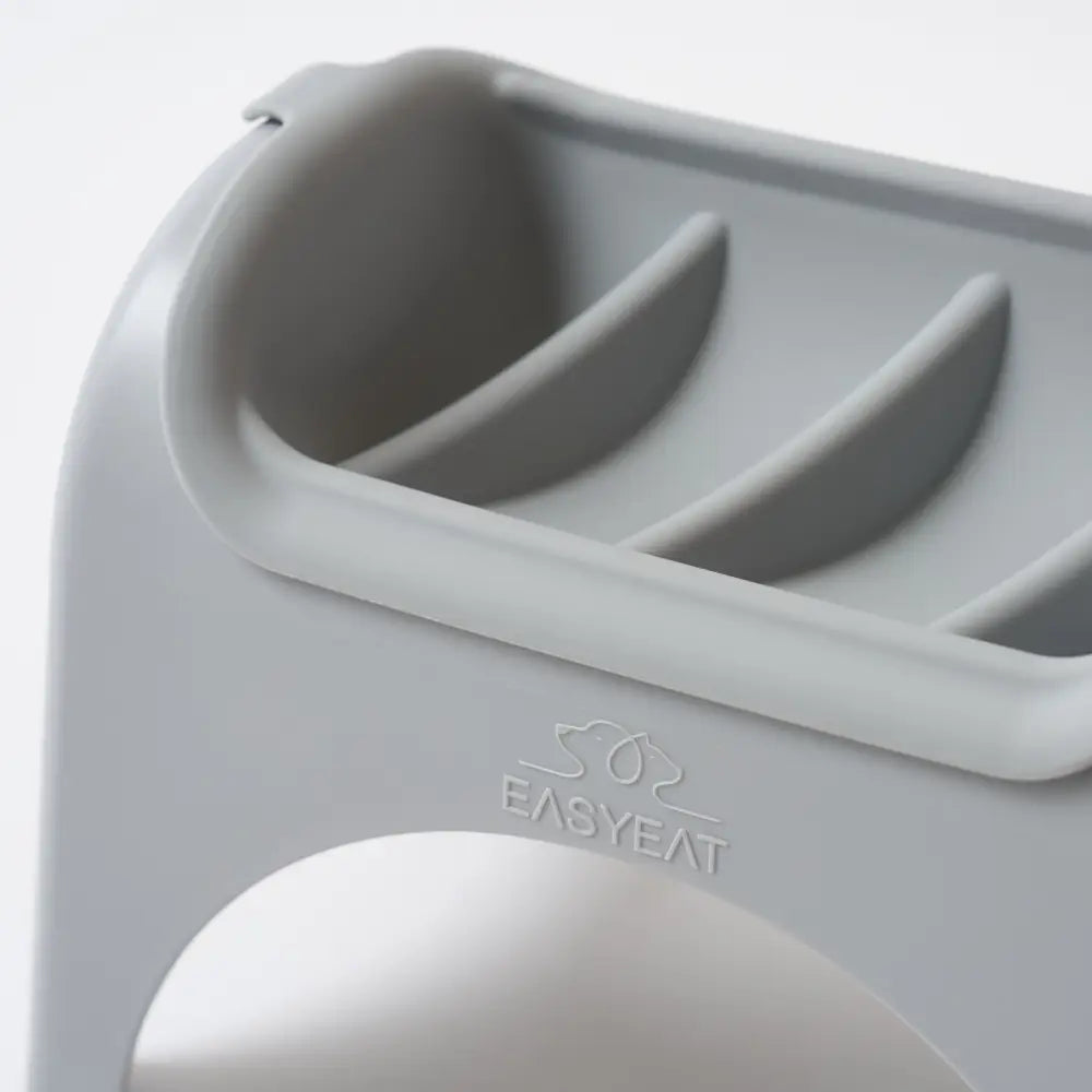 Gray EasyEat slow feeder egg holder with three curved compartments