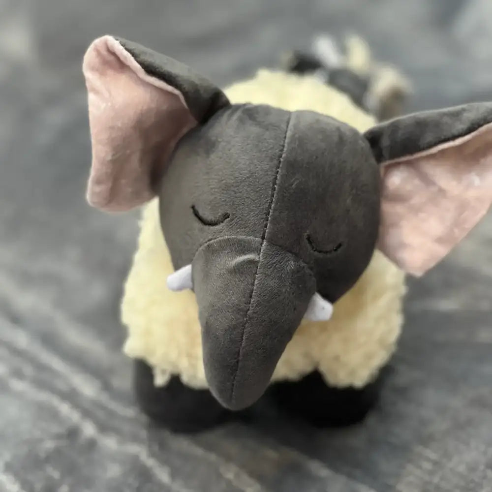 Eco Elephant plush dog toy with gray trunk, cream body, recycled materials