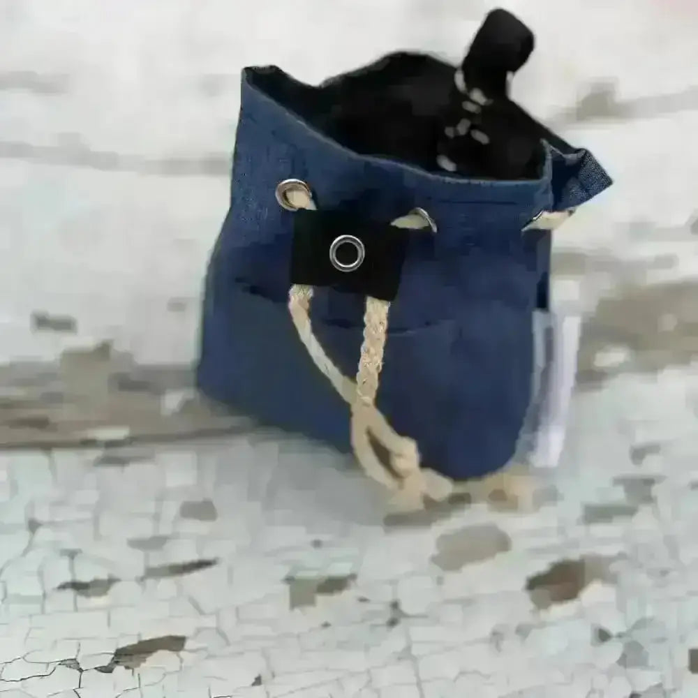 Eco treat bag made with recycled materials, blue drawstring pouch with black accents and white trim