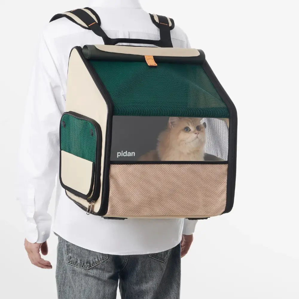 Cream-colored Petan Expandable Travel Habitat Carrier with green accents and mesh panels for cats