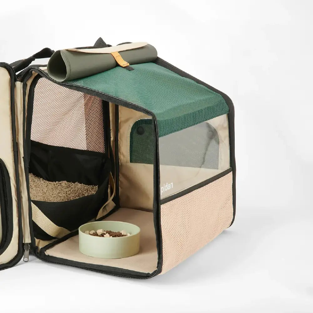 Beige and green Expandable Travel Habitat Carrier with mesh panels and a small bowl inside