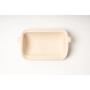 Cream-colored ceramic baking dish for best dry dog food prep