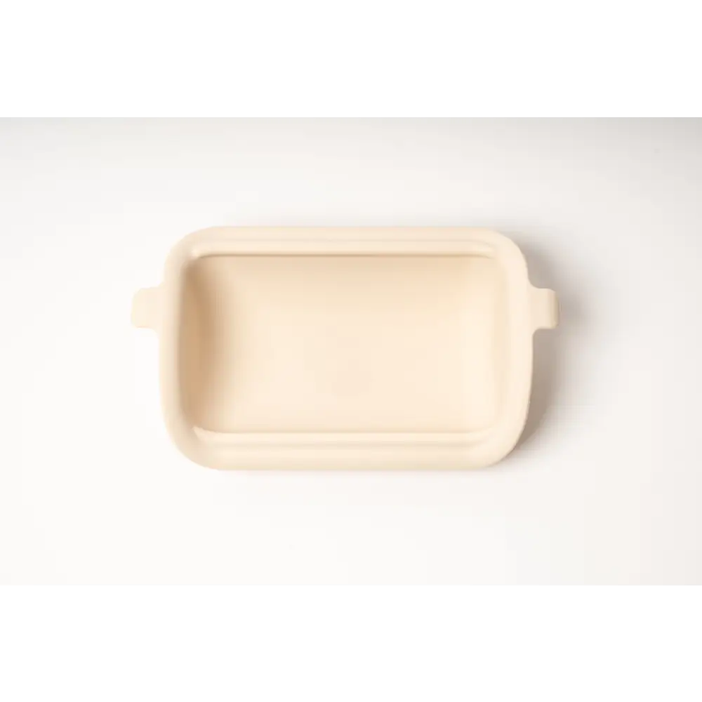 Cream-colored ceramic baking dish for best dry dog food prep