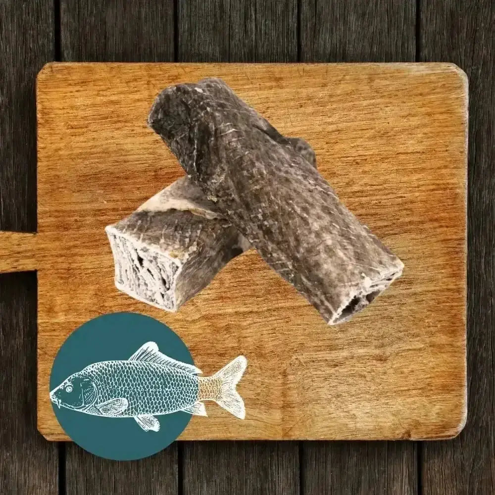 Fish stick chew on wooden board with gray texture and bone design