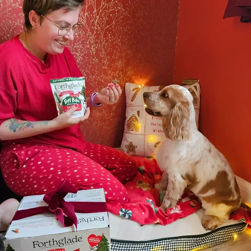 Red and white polka dot pajama pants with heart pattern on Forthglade Christmas dog treats