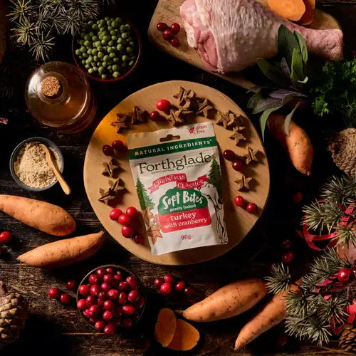 Forthglade Soft Bites package on a wooden board with festive ingredients