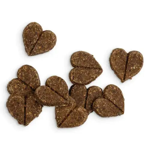 Heart-shaped dog treats with textured surface, brown color, white speckles, ideal as natural cat food