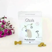 White ghost-shaped Gizzls Brain Booster dog treat bag with floral illustrations