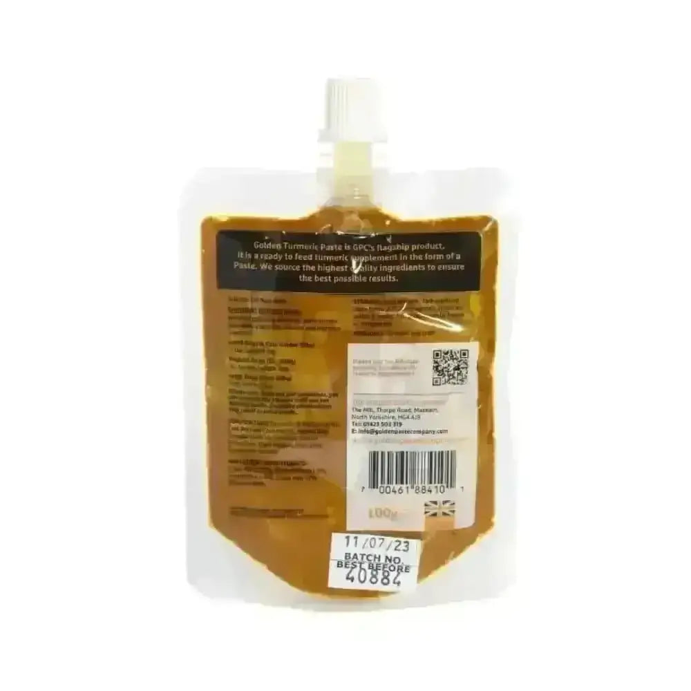 Golden paste for pets in clear pouch with white cap, contains turmeric and coconut oil
