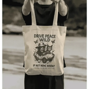 Cream-colored Gonzo Wild Tote bag with drive peace wild slogan and playful cat design
