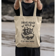 Cream-colored Gonzo Wild Tote bag with drive peace wild slogan and playful cat design