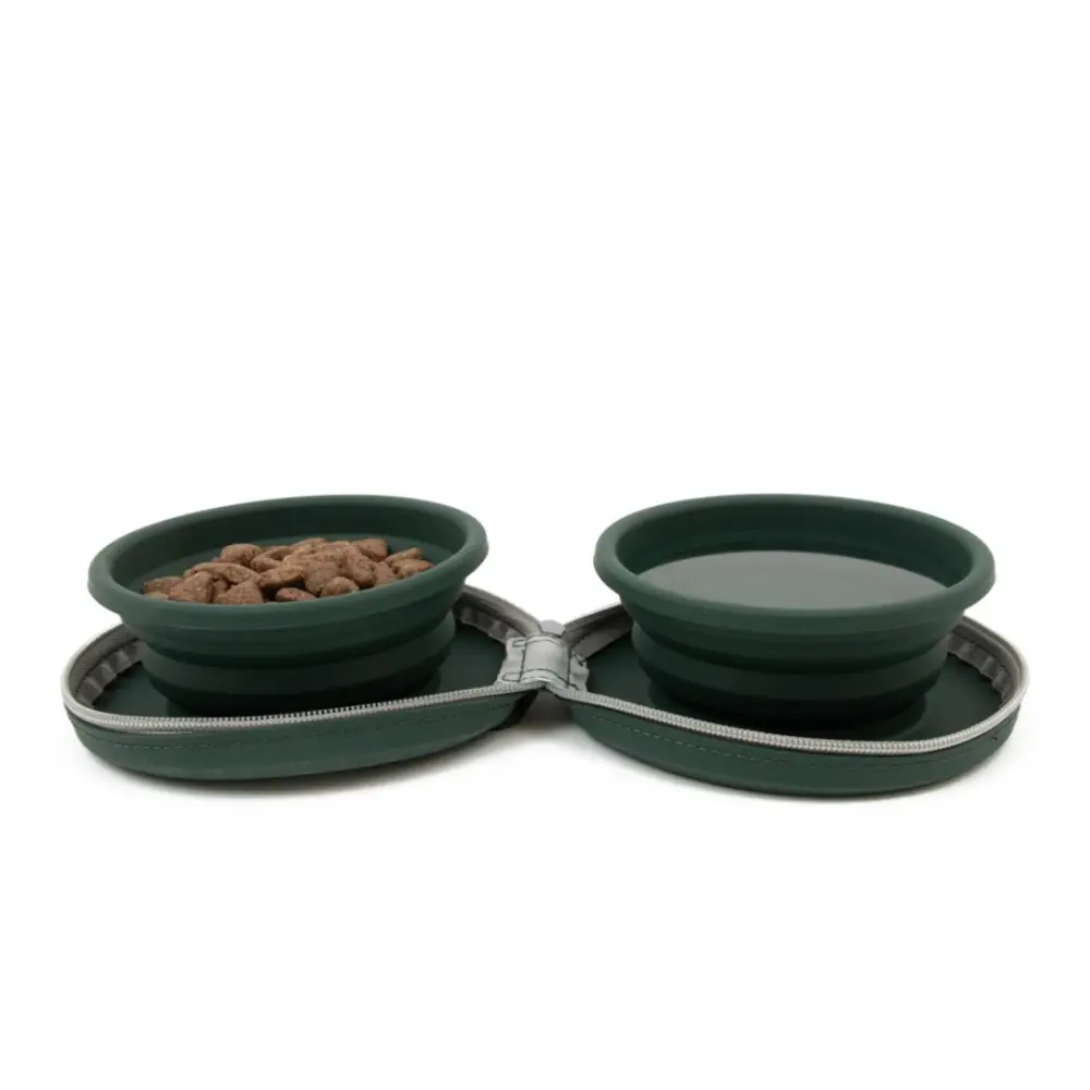 Collapsible green pet bowls with food on a white background