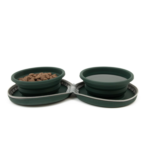 Collapsible green pet bowls with food on a white background