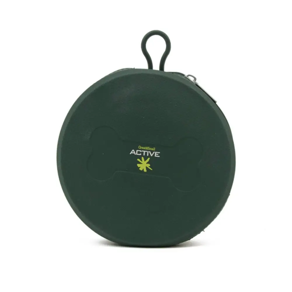 Green travel bowl sits on a white background