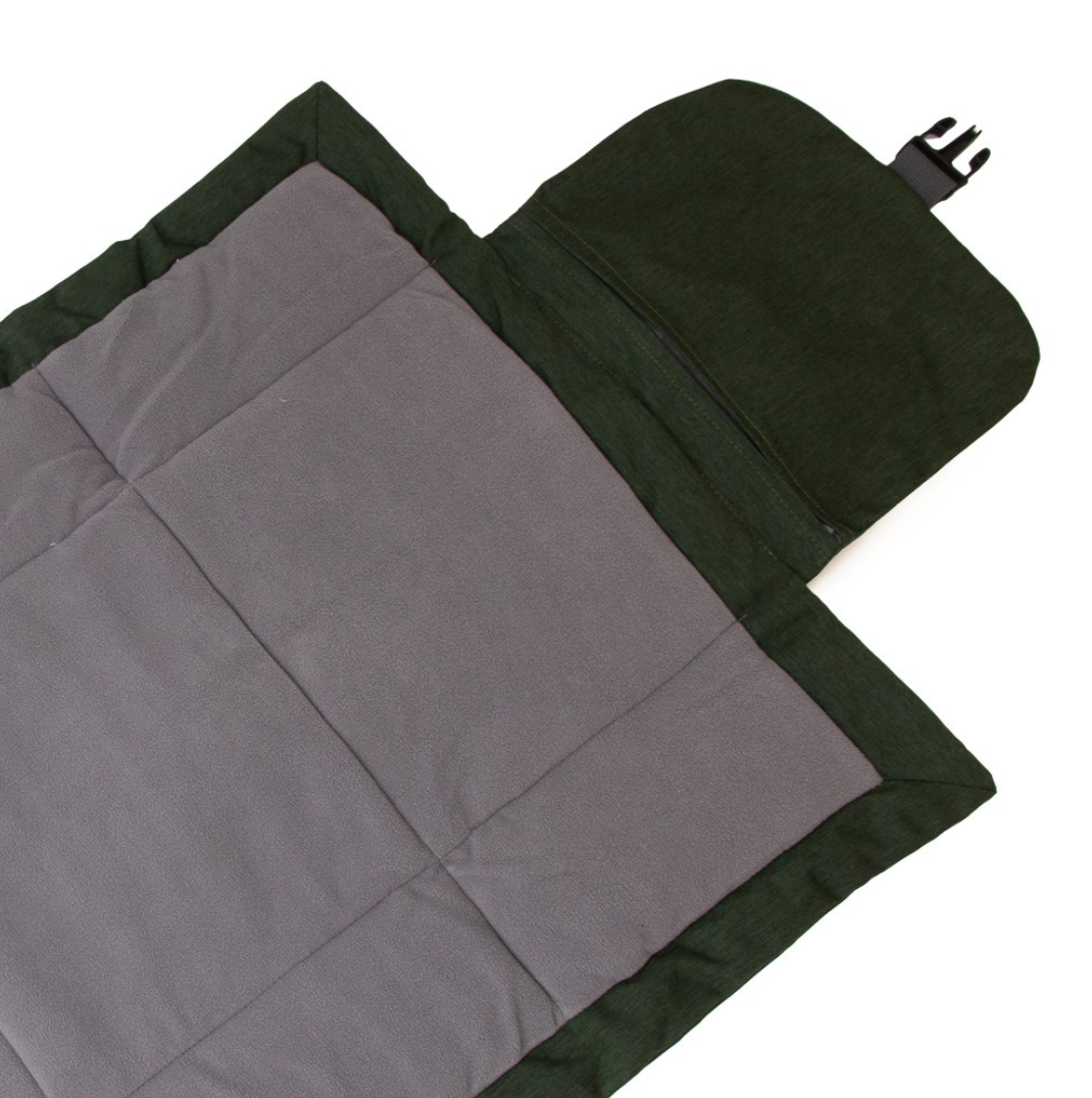 Gray and green travel mat with a zipper on a white background