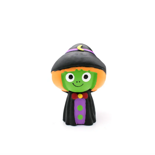 Toy figure of a witch with a black hat and green face on a white background