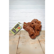 Terracotta rock dog chew from Green And Wilds Chewroots with green label
