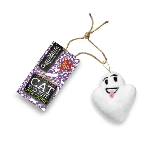 White ghost-shaped cat toy with a smiling face and pink tongue, attached to a string, next to a Green & Wilds packaging on a white background.