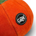 Close-up of an orange plush toy with a 'G&W' patch on a white background