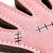 Close-up of The Hand Eco Dog Toy with stitching details