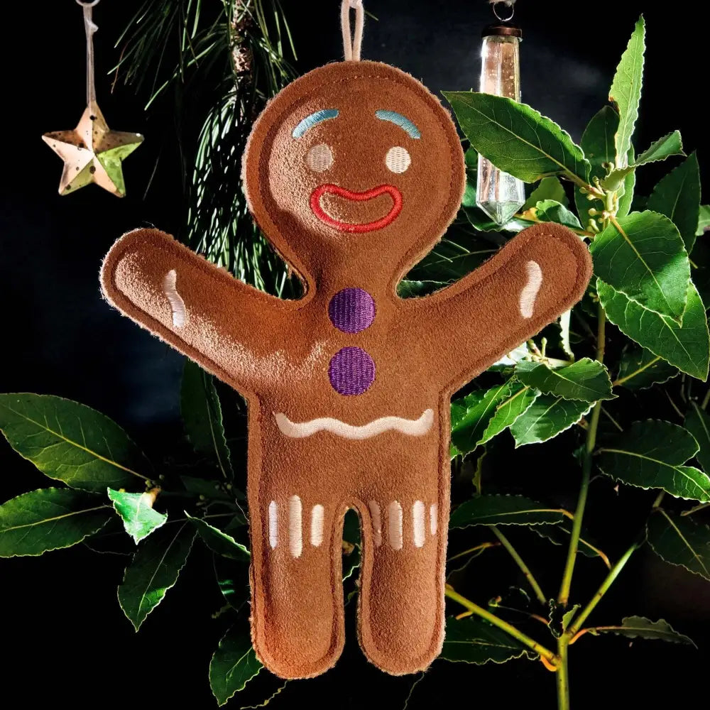 Green And Wilds Jean Genie gingerbread man ornament with purple buttons