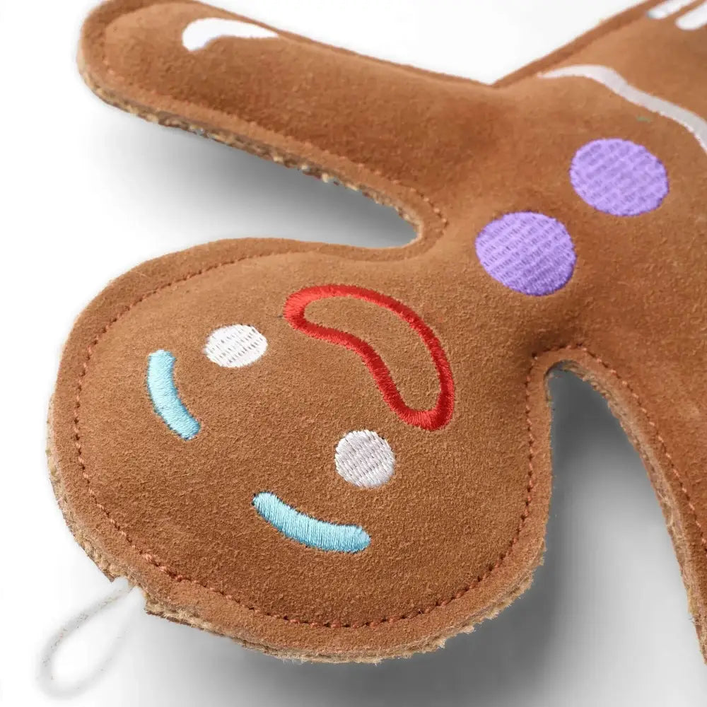 Jean Genie gingerbread plush toy with purple polka dots on suede