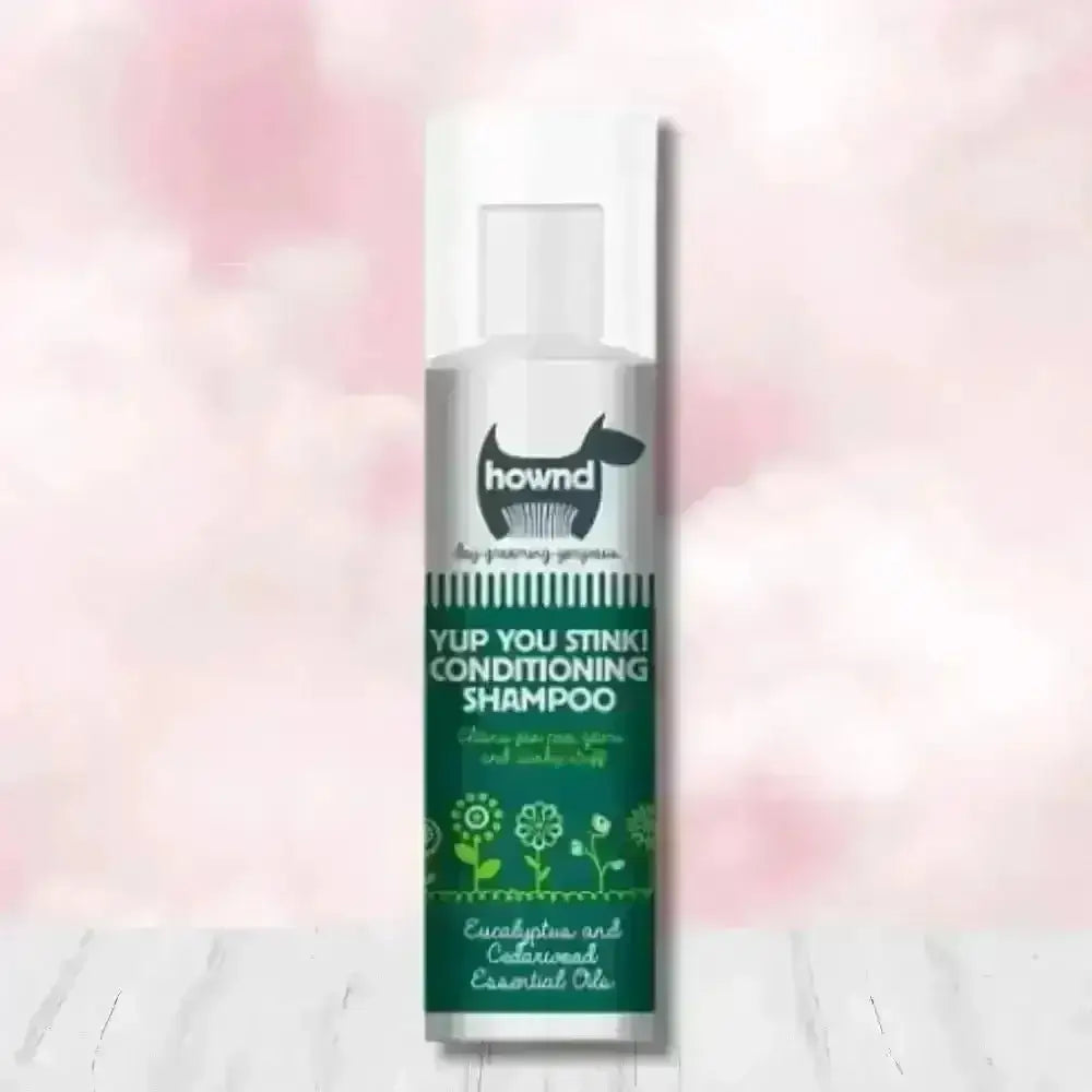 Hownd Yup You Stink Conditioning Shampoo bottle with floral design and white cap, infused with cedarwood essential oils and fox poo scent