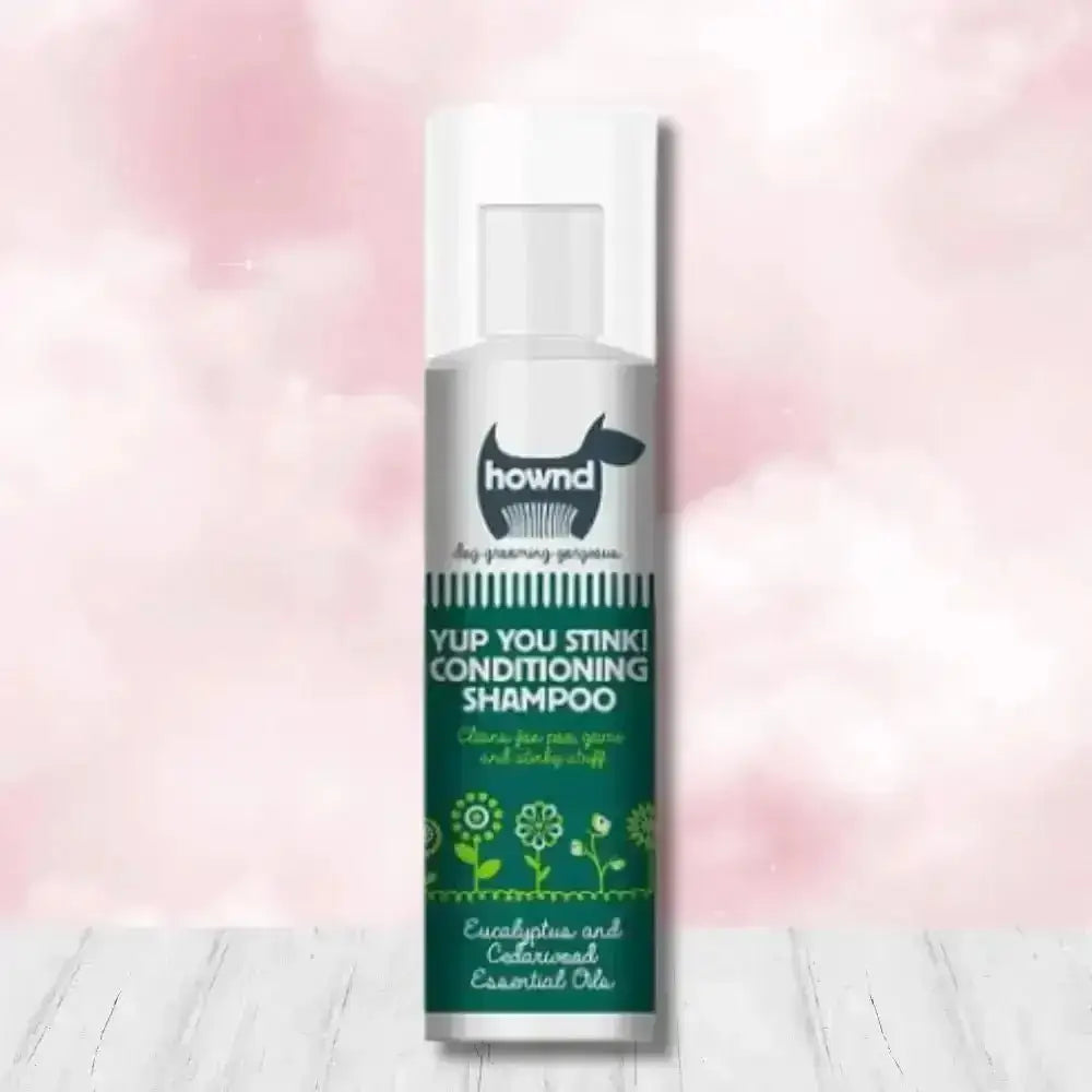 Hownd Yup You Stink Conditioning Shampoo bottle with floral design and white cap, infused with cedarwood essential oils and fox poo scent