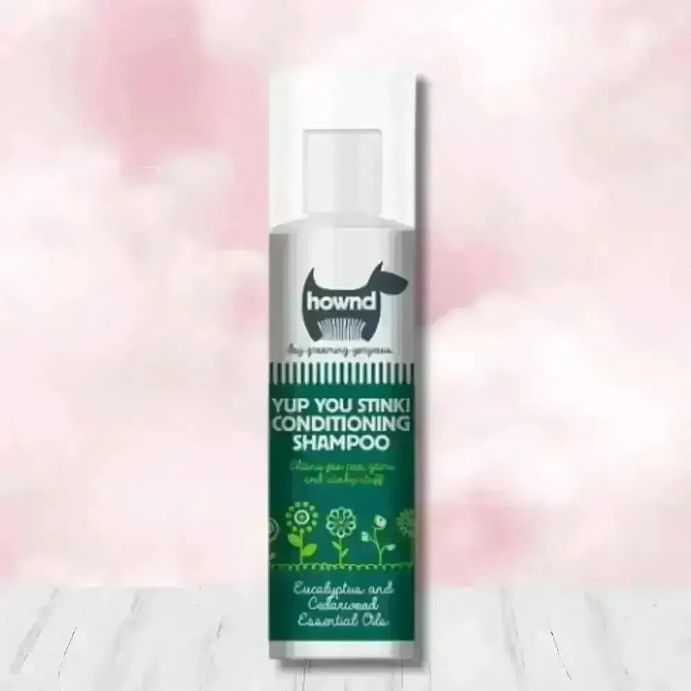 Hownd Yup You Stink Conditioning Shampoo bottle with floral design and white cap, infused with cedarwood essential oils and fox poo scent