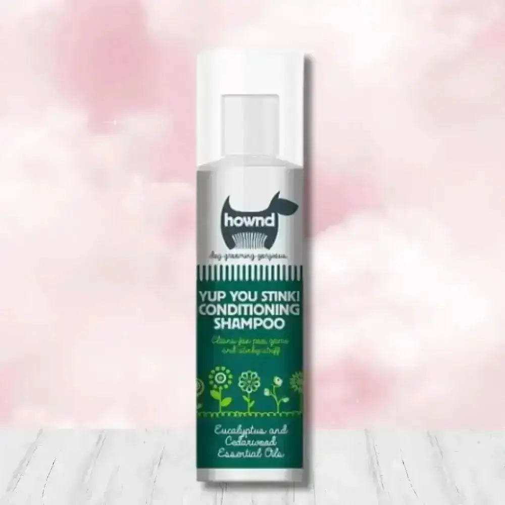 Hownd Yup You Stink Conditioning Shampoo bottle with floral design and white cap, infused with cedarwood essential oils and fox poo scent