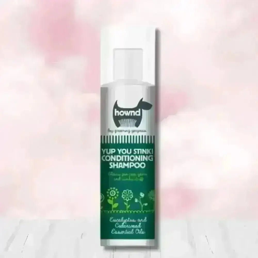 Hownd Yup You Stink Conditioning Shampoo bottle with floral design and white cap, infused with cedarwood essential oils and fox poo scent