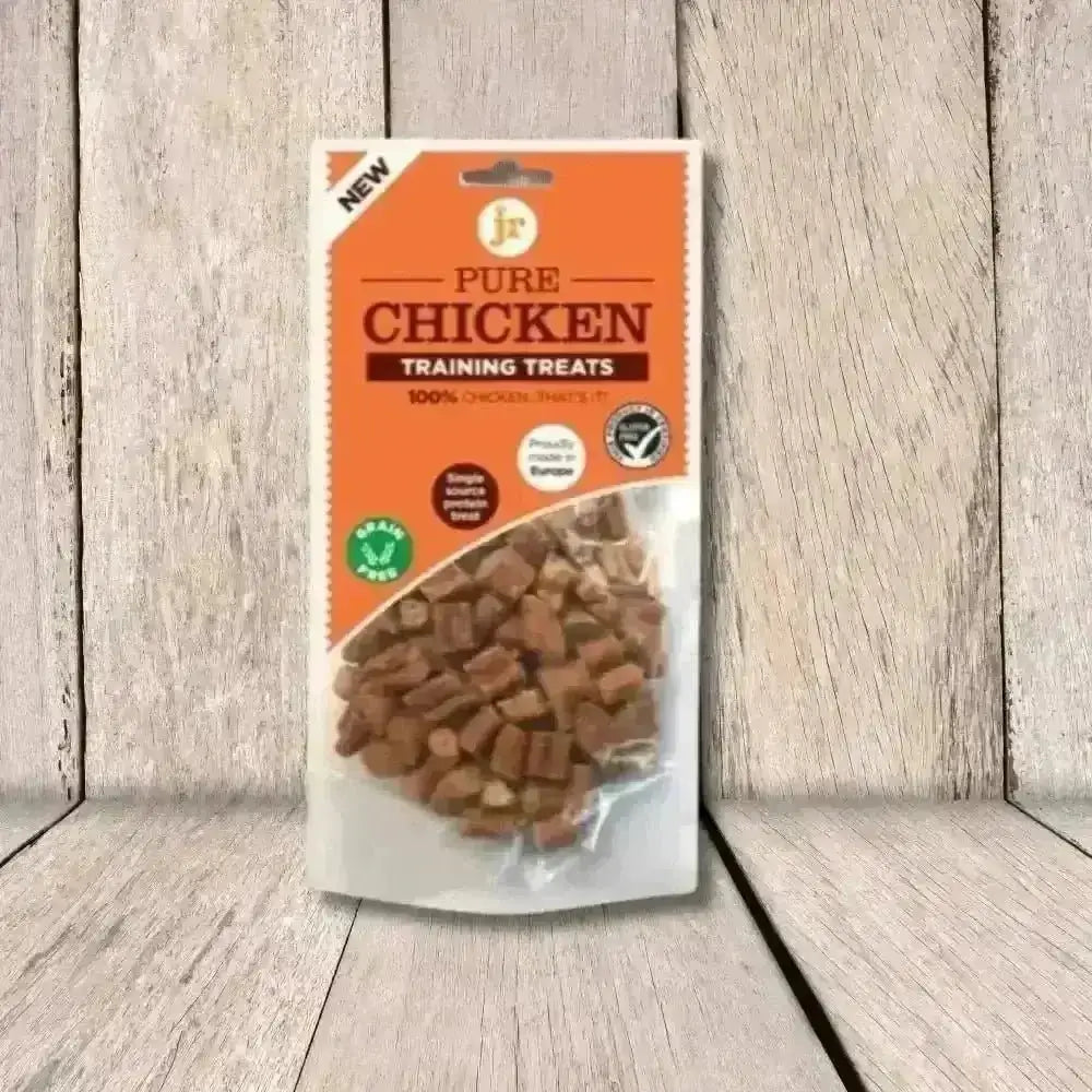 Pure Chicken Training Treats bagged snack food with orange, white, and green packaging for training