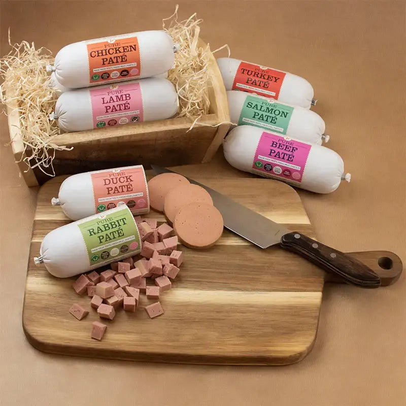 Wooden board with knife and pate rolls from JR Pet Products Pure Pate for Dogs