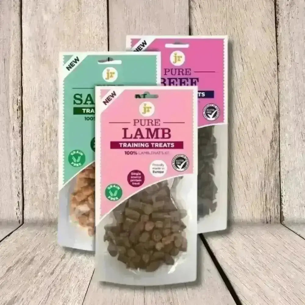 Pure training treats in clear packaging with pink and green labels, made with 100% natural ingredients