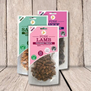 Pure training treats in clear packaging with pink and green labels, made with 100% natural ingredients