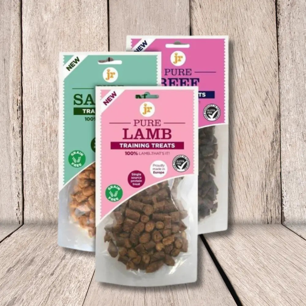 Pure training treats in clear packaging with pink and green labels, made with 100% natural ingredients