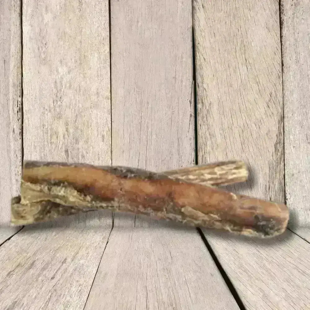 JR Pet Products Thick Bull Pizzle Chew: air dried bone-shaped pet toy in tan hues