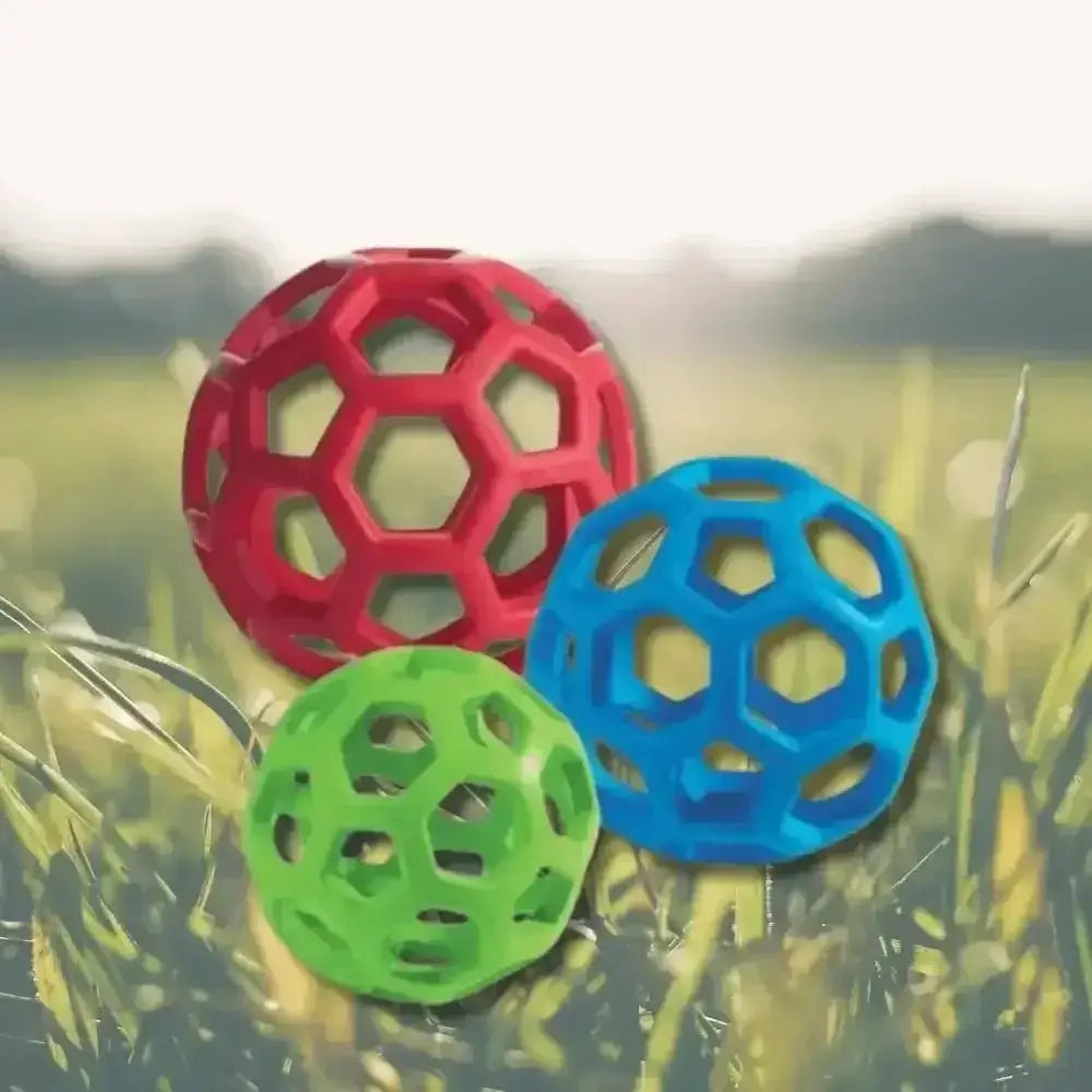 JW Hol-ee Roller: Red, green, blue super-stretchy rubber ball with hex pattern
