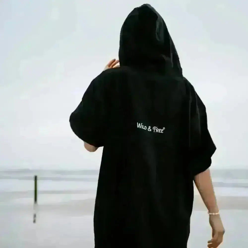 Black hooded towel robe with wild and free text and pocket