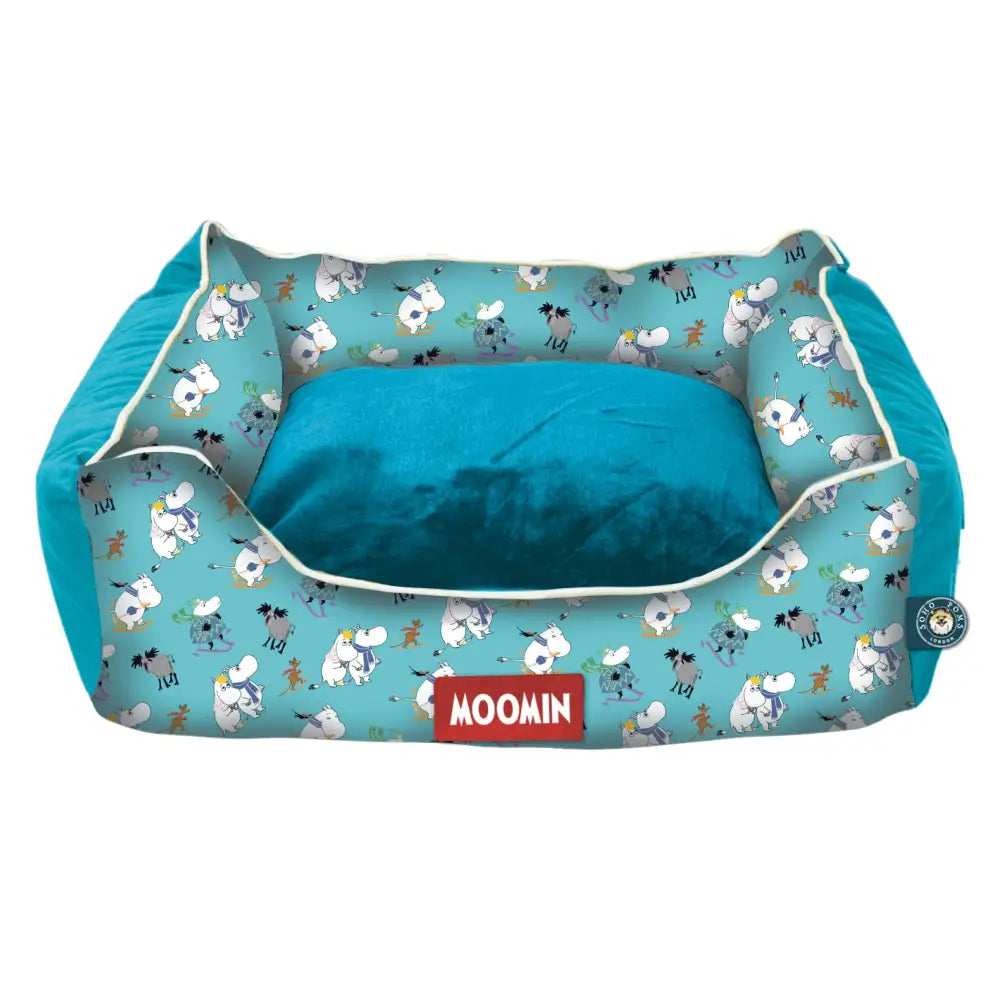 Moomin pet bed with sheep pattern in teal and white, perfect for blue ski holidays